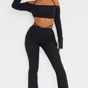 Black stretch cutout flared pants